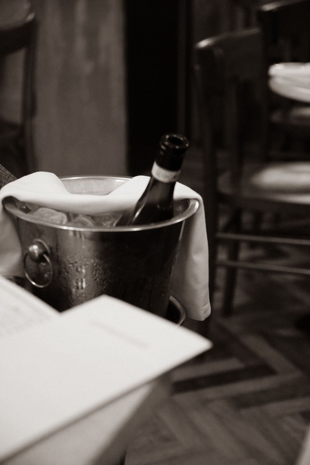 Black and White Image of Wine in a Bucket in Italy