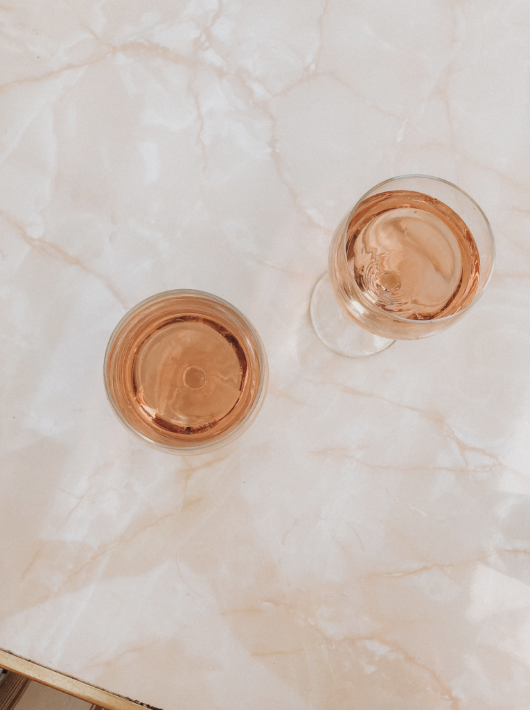 Rose glasses on a marble table in Provence